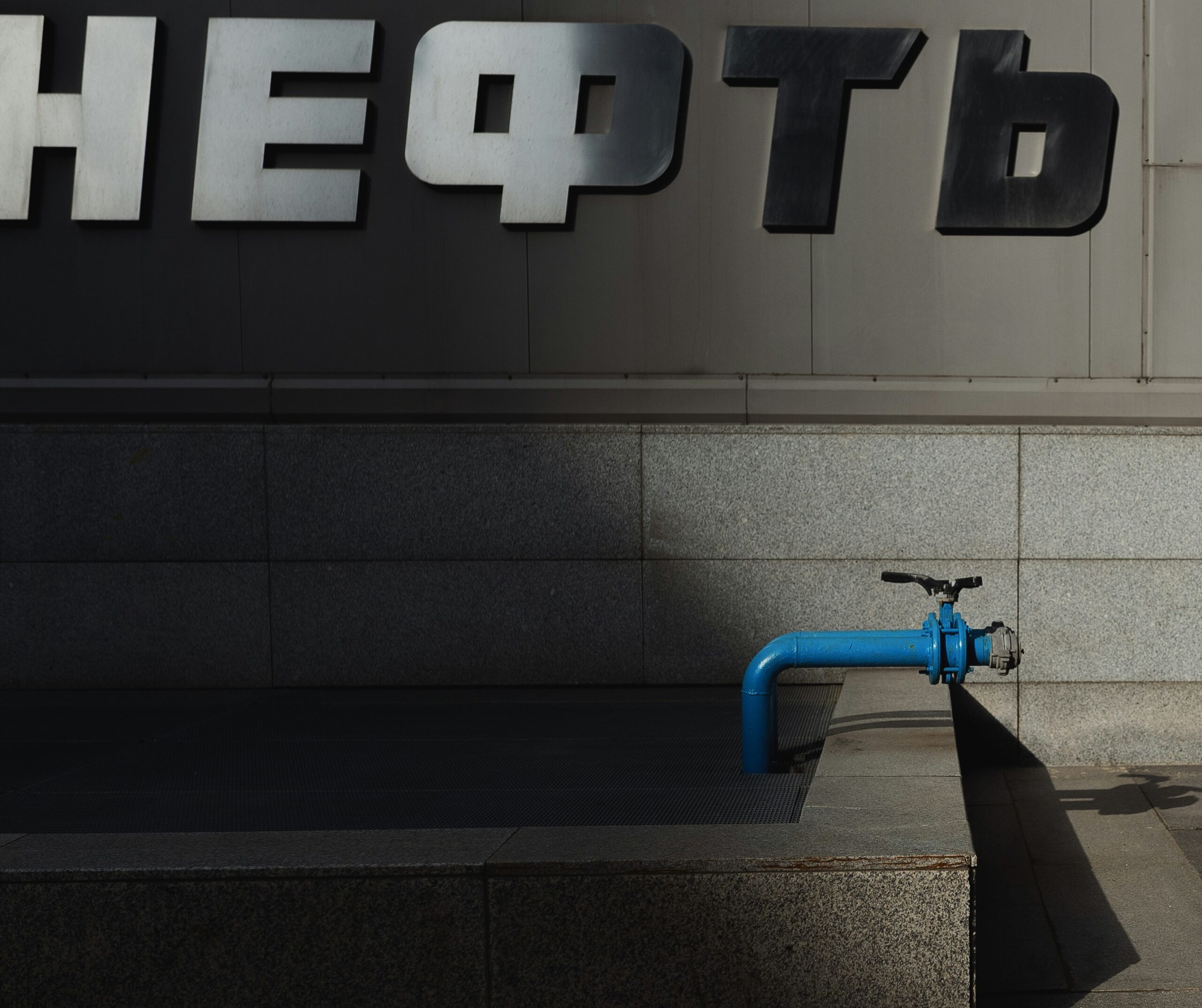 a blue bike parked in front of a building